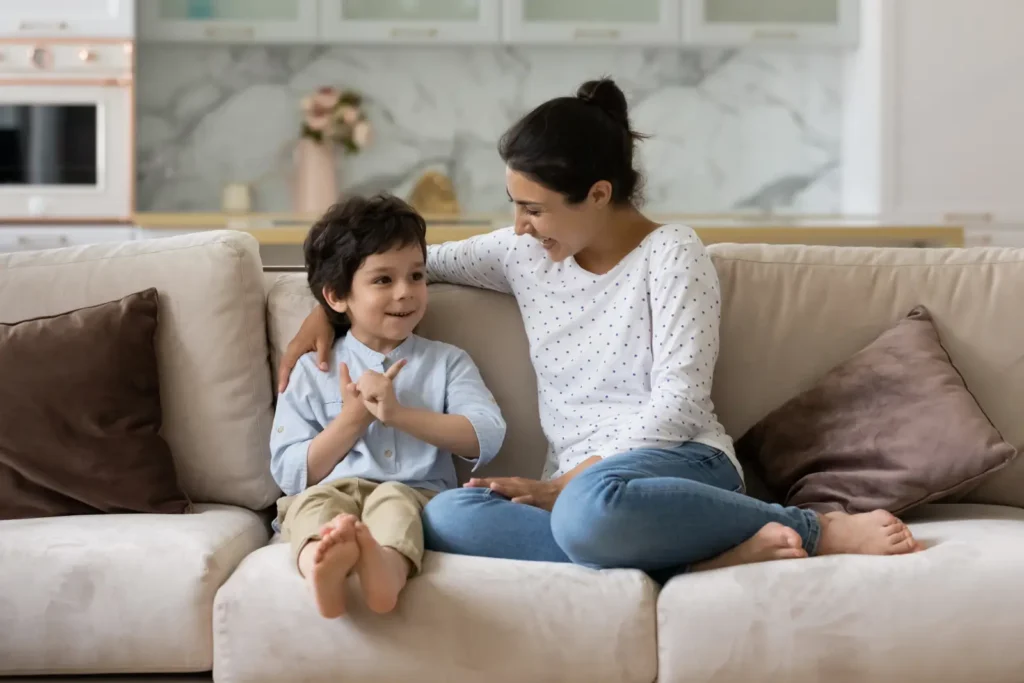Parent and child talking together at home